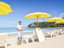 Sunny beach with yellow umbrellas and lounge chairs