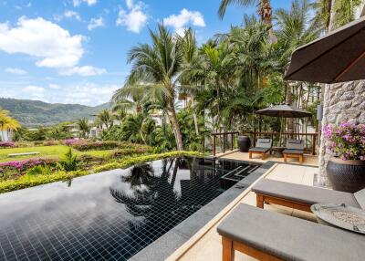 Luxurious outdoor area with pool and lounge