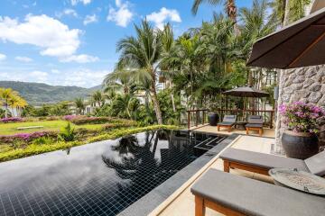 Luxurious outdoor area with pool and lounge