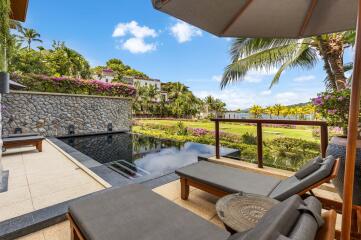 Luxury outdoor area with pool and lounge chairs