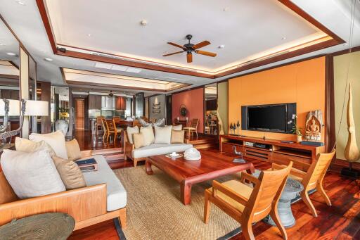 Spacious and modern living room with wooden furniture and integrated dining area