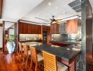 Spacious modern kitchen with wooden cabinets and island seating