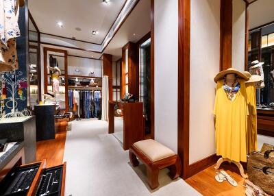 Spacious walk-in closet with wooden finishes and ample storage