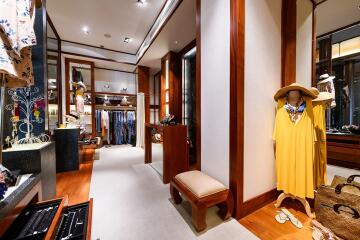 Spacious walk-in closet with wooden finishes and ample storage