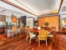 Spacious dining area with wooden furniture and polished hardwood floors