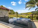 Outdoor area with infinity pool and scenic view