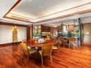 Spacious dining area with wooden flooring and furniture