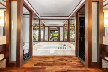 Modern luxurious bathroom with wooden accents