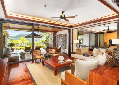 Spacious living room with large sliding glass doors leading to a terrace with scenic outdoor views