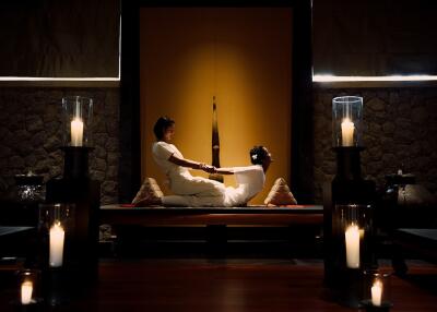 Professional massage session in a serene spa-like environment with ambient lighting