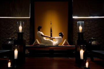 Professional massage session in a serene spa-like environment with ambient lighting