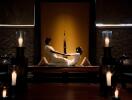 Professional massage session in a serene spa-like environment with ambient lighting