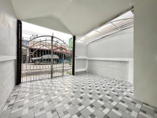 Covered outdoor space with tiled floor