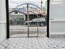 Entrance area with gate and tiled flooring