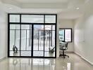 Bright living area with large glass doors and office nook