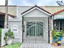 Exterior view of a house with gated entry