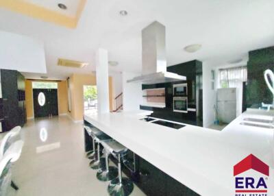 Modern kitchen with bar seating and appliances