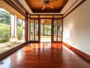 Spacious living area with wooden floors and large windows