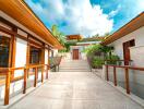 Modern building entrance with outdoor stairs and wooden railings