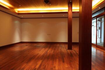 Spacious living room with wooden flooring and ceiling lights