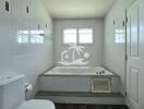 Modern bathroom with tiled walls and a bathtub