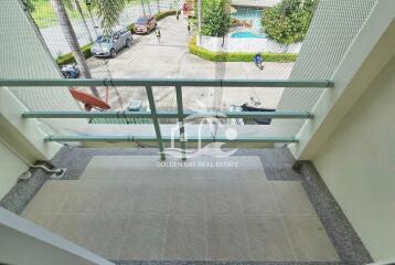 Balcony view with safety railing and street view