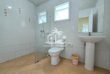 Modern bathroom with shower and white tiles