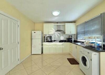 Modern kitchen with white cabinets and appliances