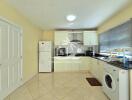 Modern kitchen with white cabinets and appliances