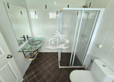 Modern bathroom with glass shower and glass sink