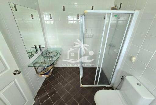 Modern bathroom with glass shower and glass sink