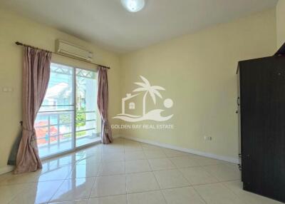 Bright bedroom with sliding glass doors and balcony access