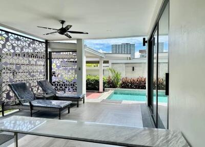 Outdoor patio with pool view