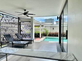 Outdoor patio with pool view