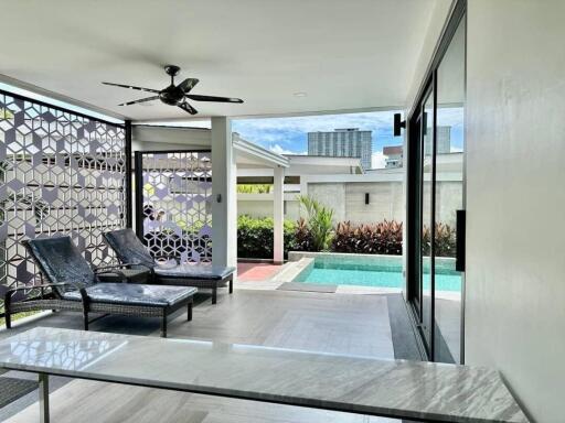 Outdoor patio with pool view