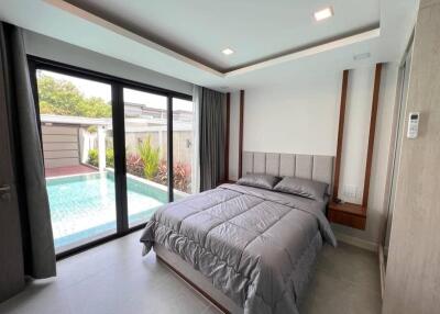 Modern bedroom with pool view