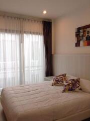 Bedroom with large windows and modern decor