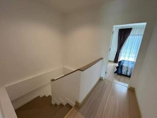 View from the top of the staircase leading to the bedroom