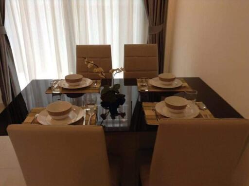 Modern dining room with table set for four