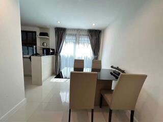 Modern dining area with contemporary furniture and large windows