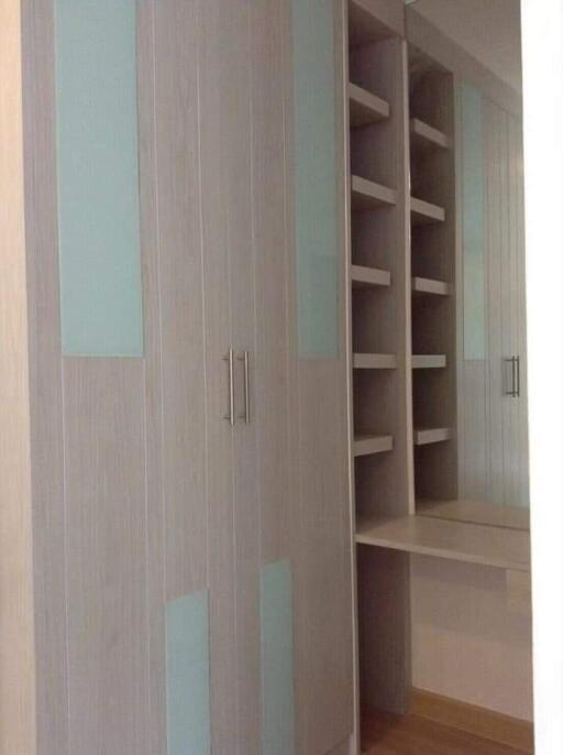 Spacious built-in closet with shelves