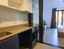 Open studio apartment with kitchenette and bedroom area