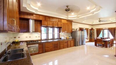 Spacious kitchen with wooden cabinets and modern appliances