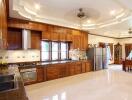 Spacious kitchen with wooden cabinets and modern appliances