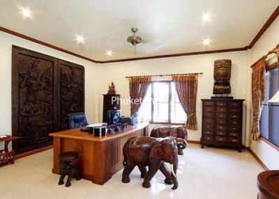 Home office with wooden desk and elephant-shaped chairs