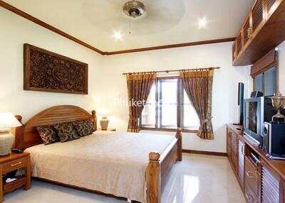 Bedroom with wooden furniture and decor