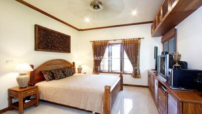 Bedroom with wooden furniture and decor