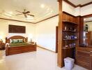 Spacious and well-furnished bedroom with wooden decor