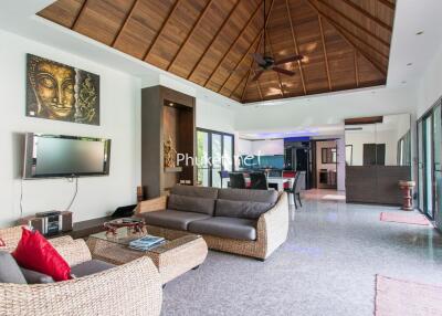 Spacious living room with modern furniture and high ceiling