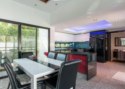 Modern kitchen and dining area with glass doors